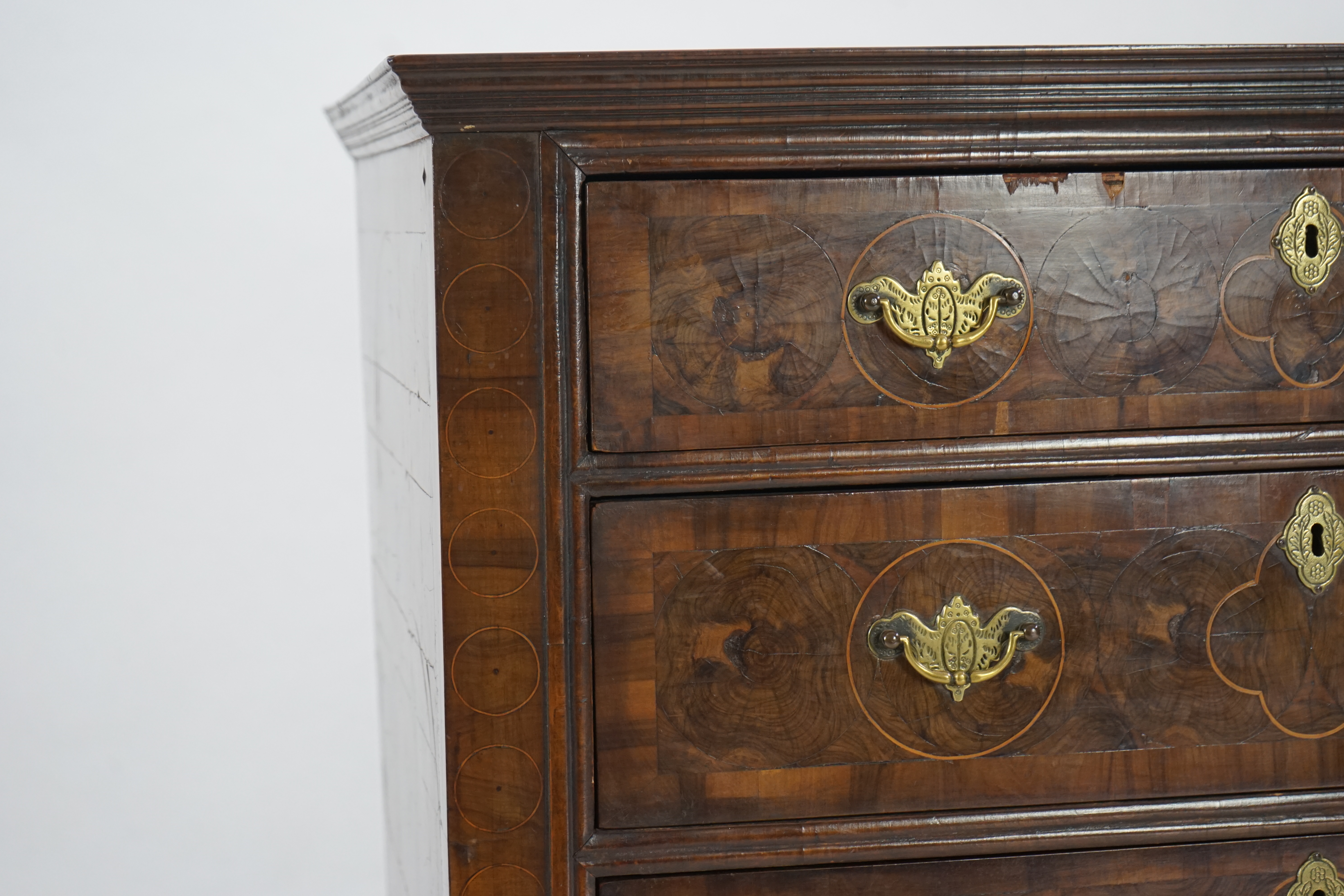 A William and Mary oyster veneered laburnum and walnut chest